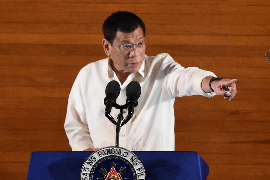 Philippine President Rodrigo Duterte gestures at lectern