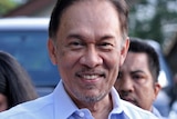 Anwar Ibrahim leaves for court on the day of the verdict in his trial.