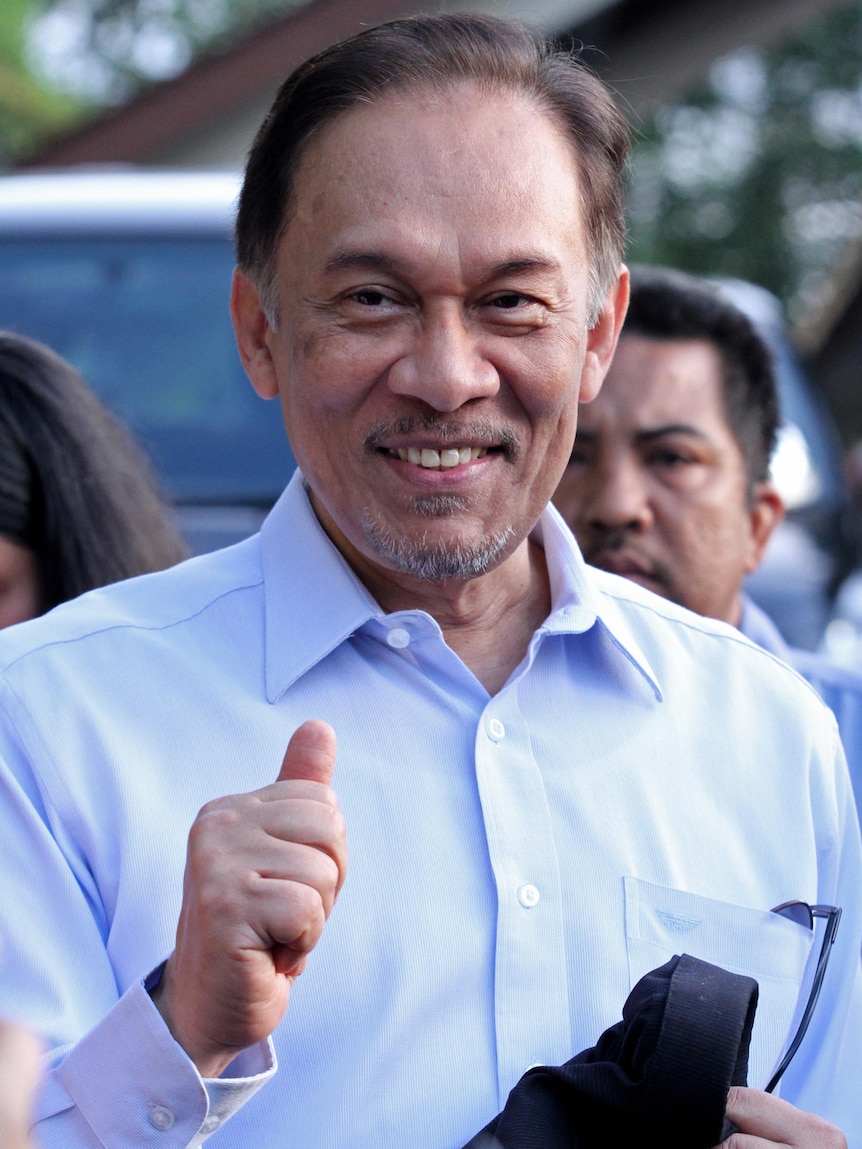 Anwar Ibrahim leaves for court on the day of the verdict in his trial.