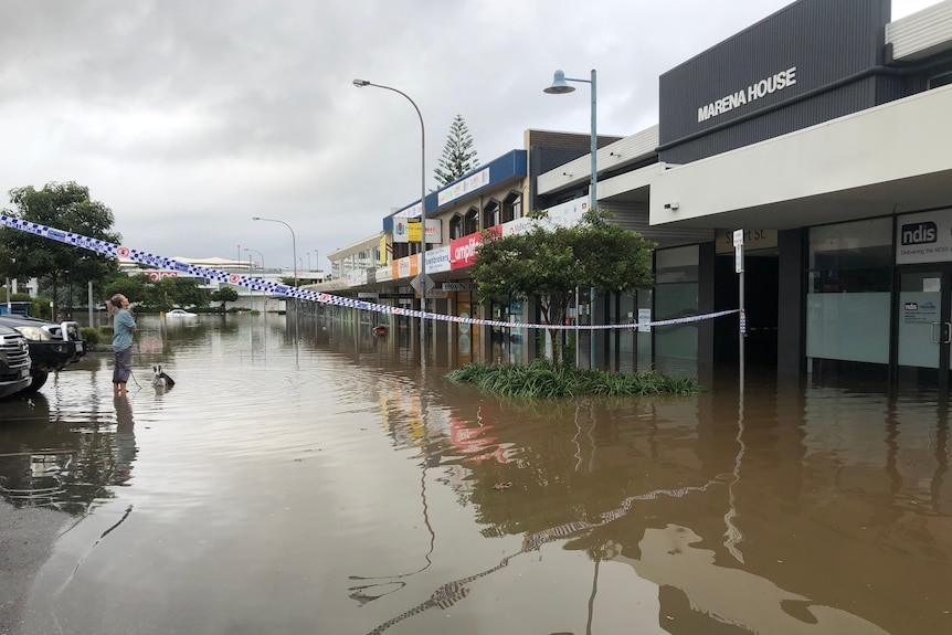 A street with shops flooded