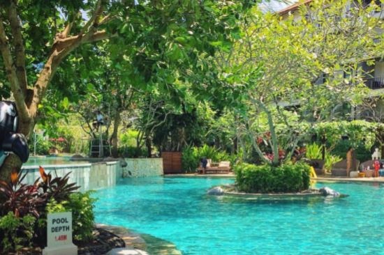 Woman in pool at Accor Vacation Club getaway in Bali.