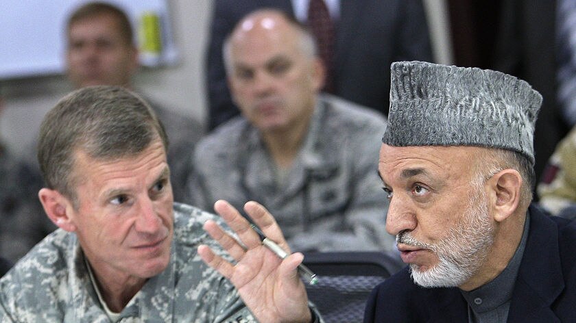 Hamid Karzai speaks with General Stanley McChrystal