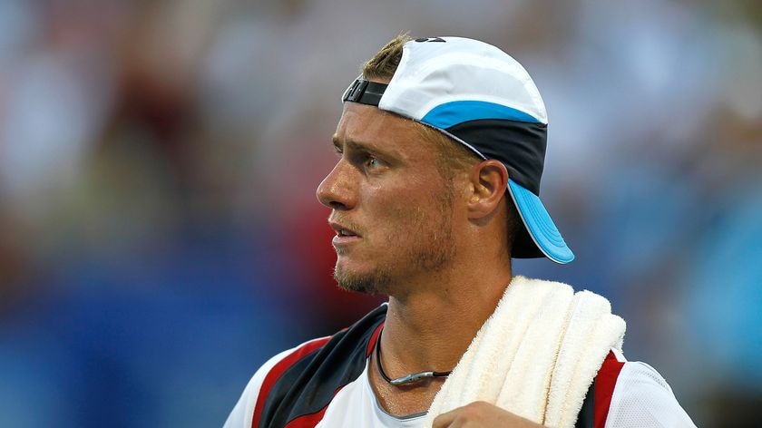 Lleyton Hewitt takes a break during his defeat.