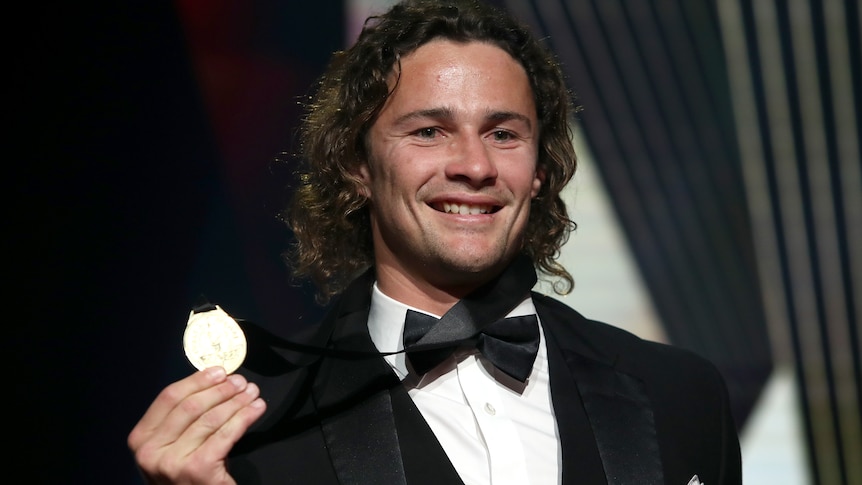 Nicho Hynes holds up the Dally M