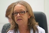 Education Minister Joy Burch listens to the Opposition's bid for an inquiry into a controversy involving her son.