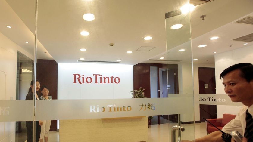 The Rio Tinto staff are accused of bribing officials.