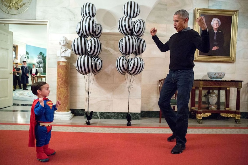 Obama greets a child dressed up for Halloween
