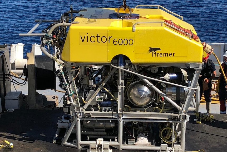 A yellow robot vessel on a boat.