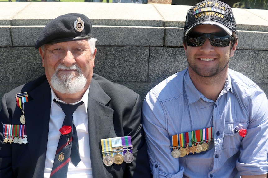WWII veteran Brian Wood with grandson Cameron Hancock.