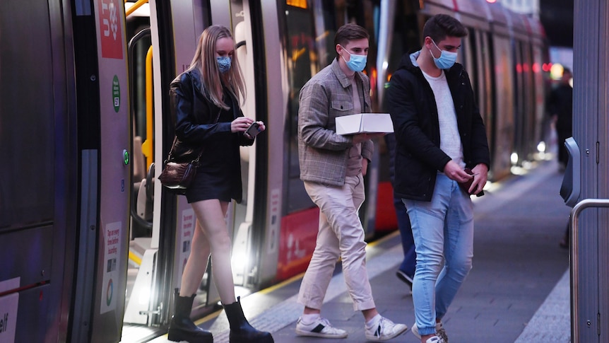 Teenagers wearing masks