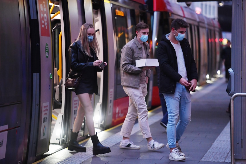 Teenagers wearing masks