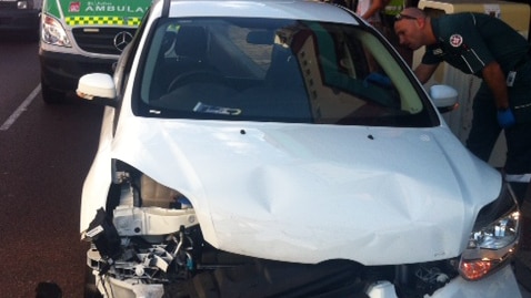 The damaged car after a vehicle crashed into it