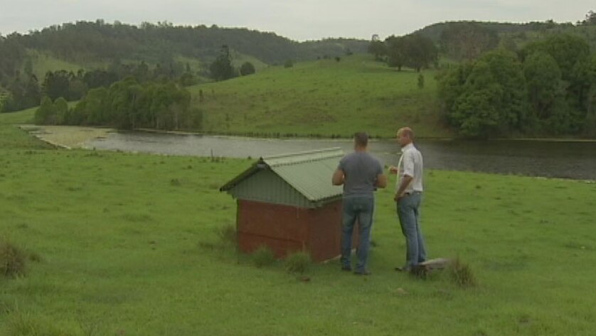 Shaun Martin shows reporter Tom Forbes the spring water bore on his property in northern NSW.