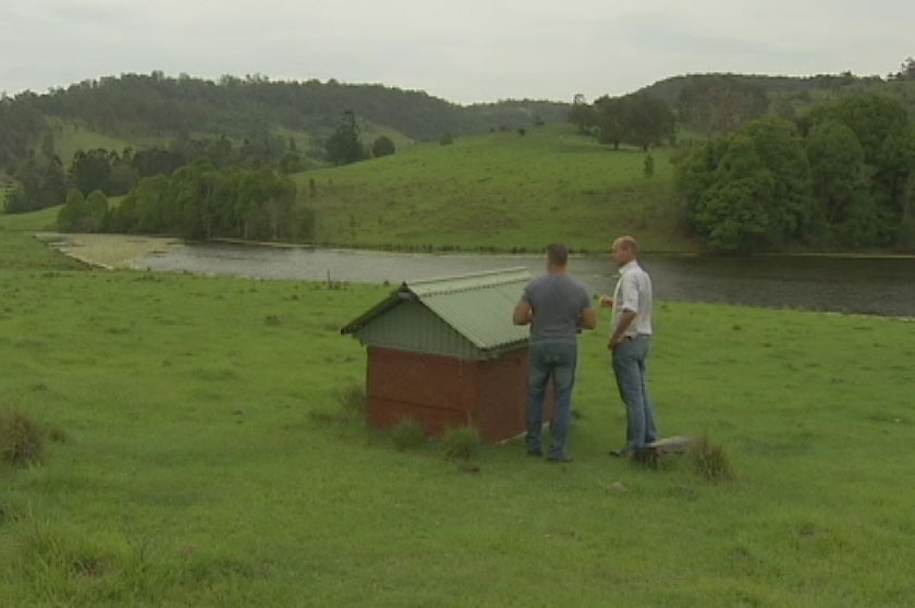Shaun Martin shows reporter Tom Forbes the spring water bore on his property in northern NSW.