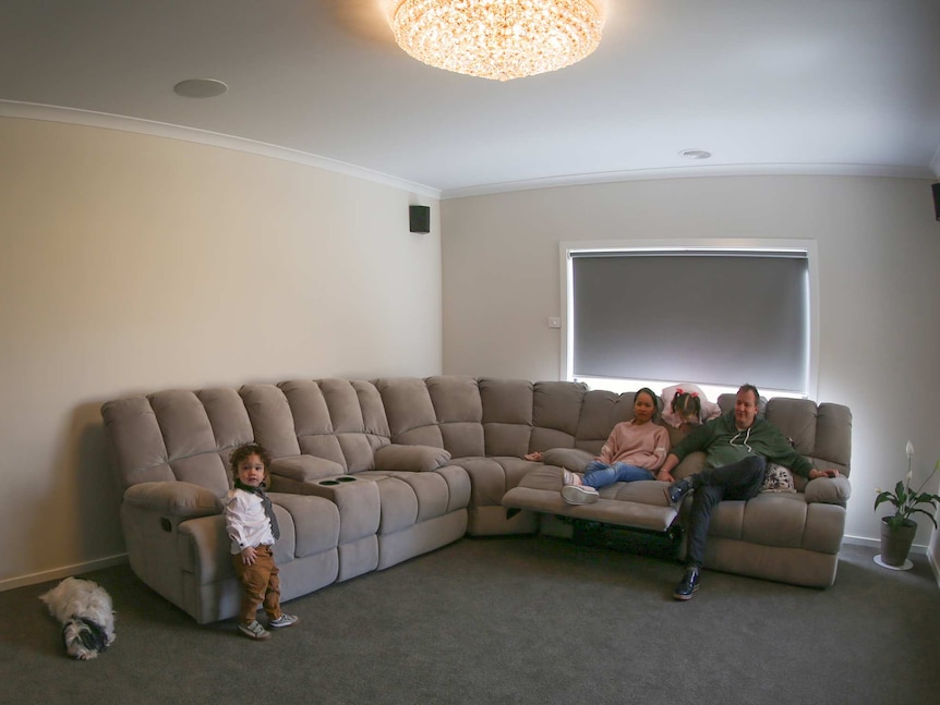Mickleham family Angelica and Darren Young and their children Lincoln and Chelsea sit on their couch