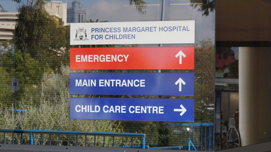 Signs on windows outside Princess Margaret Hospital showing directions.