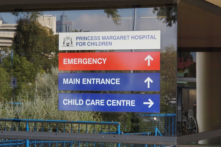 Signs on windows outside Princess Margaret Hospital showing directions.