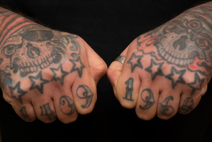 Tattboy's fingers have numbers that represent his birthdate, 1409 1968.