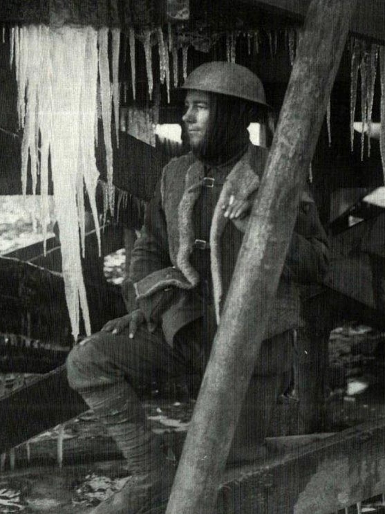 An Australian soldier wears a sheepskin vest in the trenches of the Western Front during WW1.