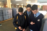 New Town High students check phones