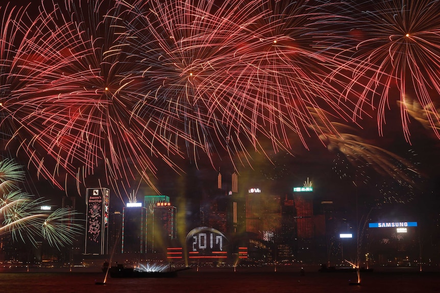 Fireworks explode over Victoria Harbour to celebrate the New Year's Eve in Hong Kong, early Sunday, Jan. 1, 2017.