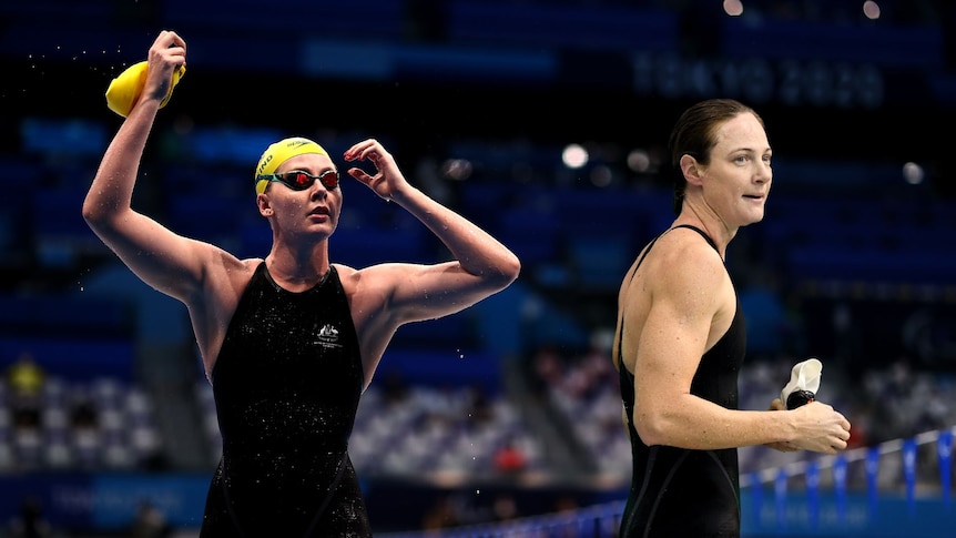 Katja Dedekind wearing goggles and cap on pool deck, and Cate Campbell with her cap off after a swim 