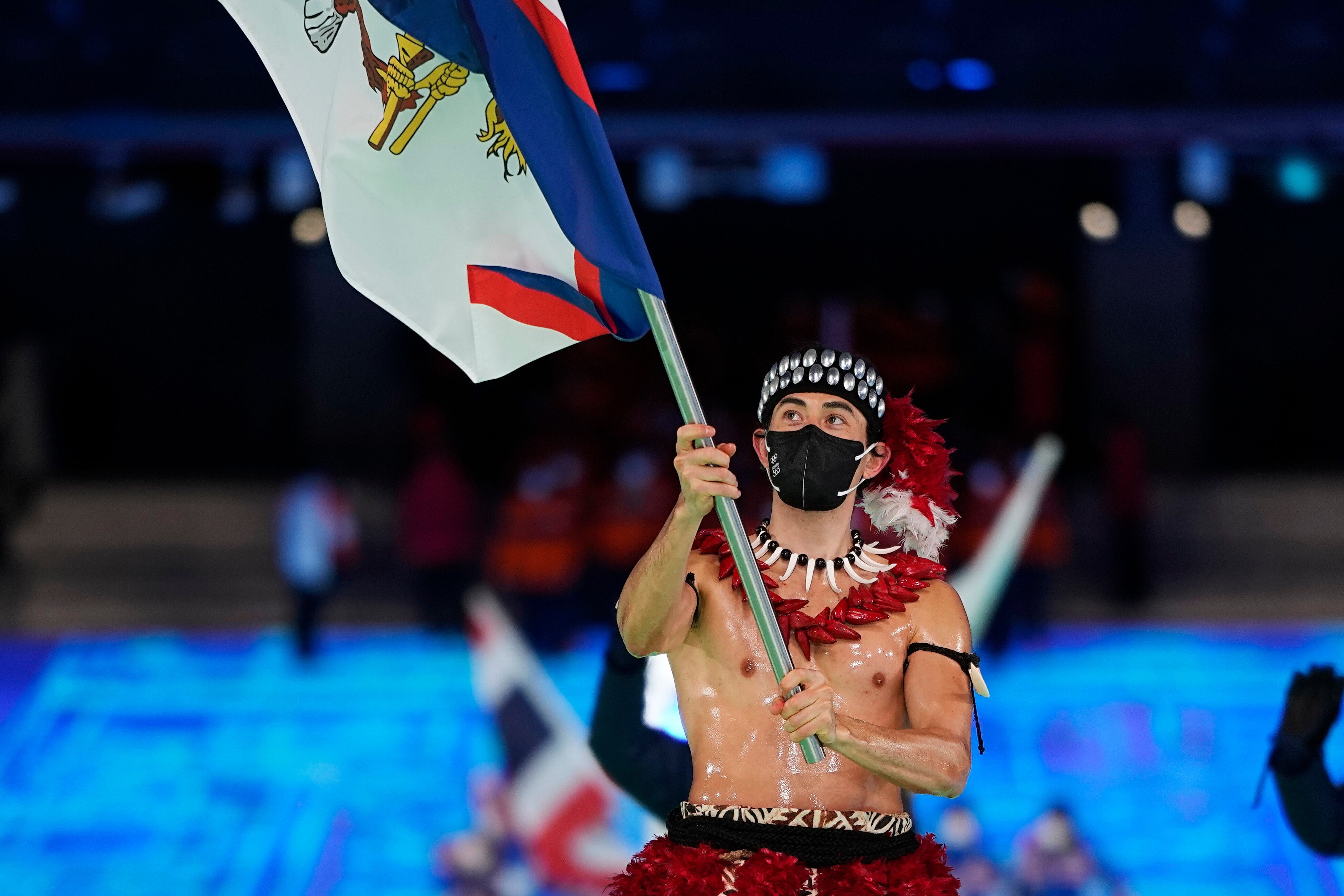Rugged-up Aussies make their entrance but shirtless American Samoan steals show — Winter Olympics opening as it happened
