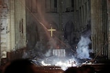 Smoke drifts through the interior of Notre Dame cathedral.