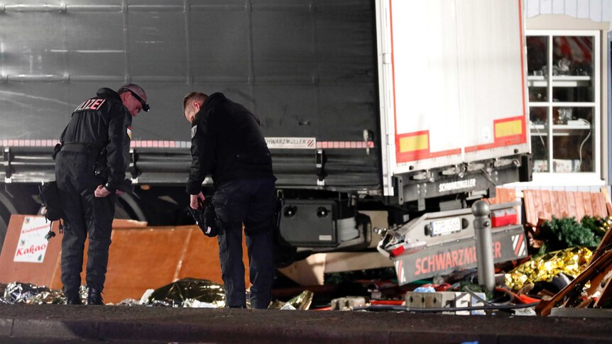 Police investigate near truck at Berlin Christmas market
