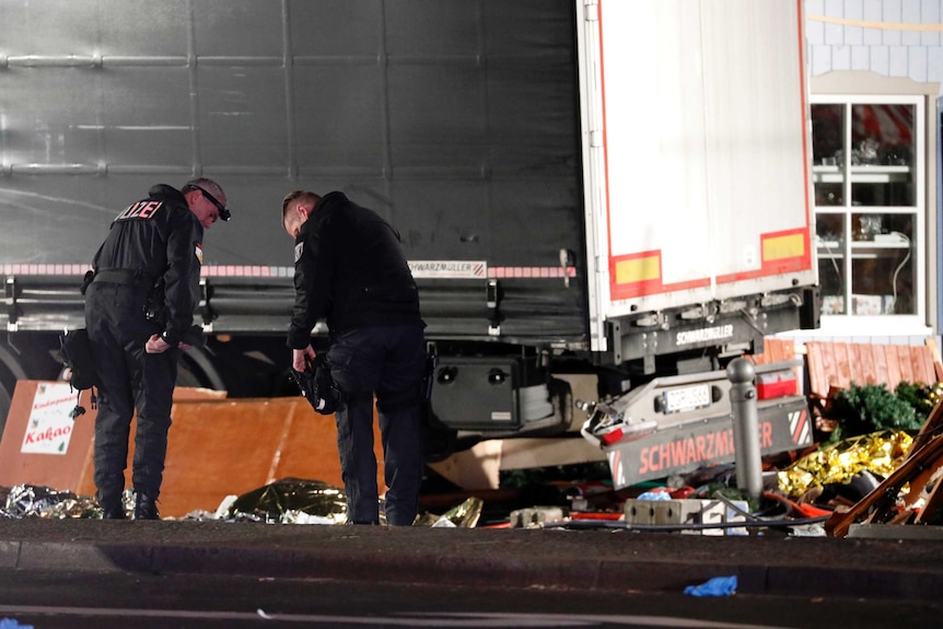 Police investigate near truck at Berlin Christmas market
