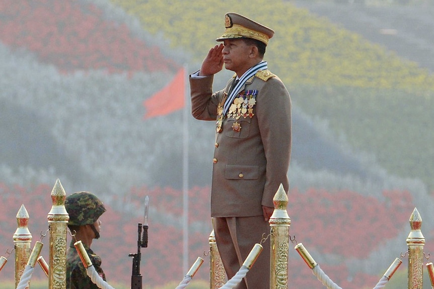 Senior General Min Aung Hlaing salutes during a military parade in Myanmar