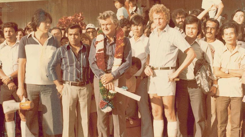 A crowd of men posing for the camera.