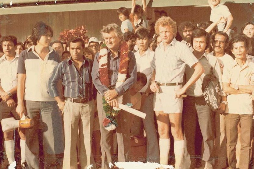 A crowd of males posing for the camera.