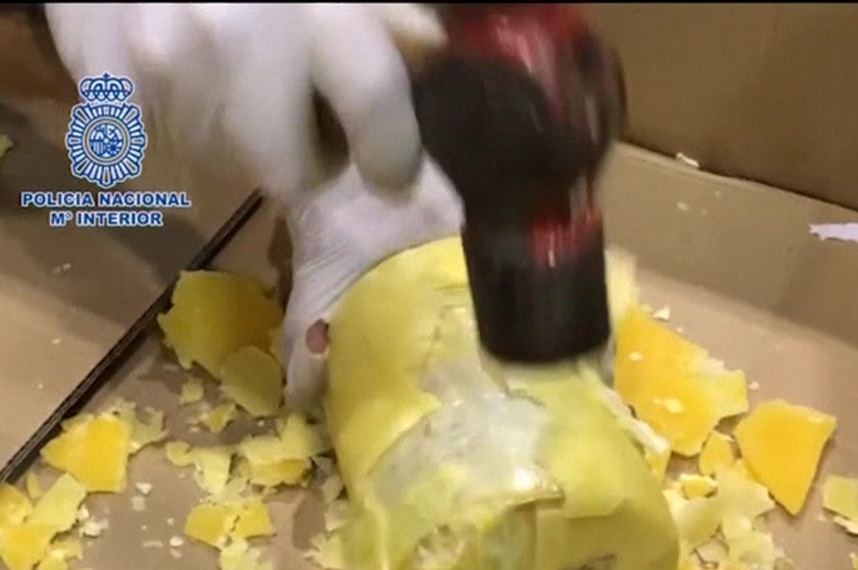 Police in Portugal and Spain smash open package containing cocaine disguised as a pineapple.