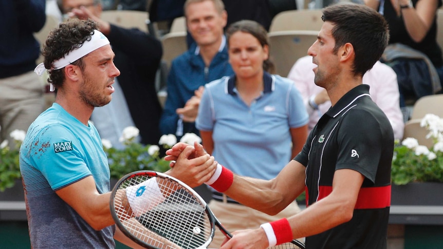 Italy's Marco Cecchinato (L), is congratulated by Serbia's Novak Djokovic at the French Open.