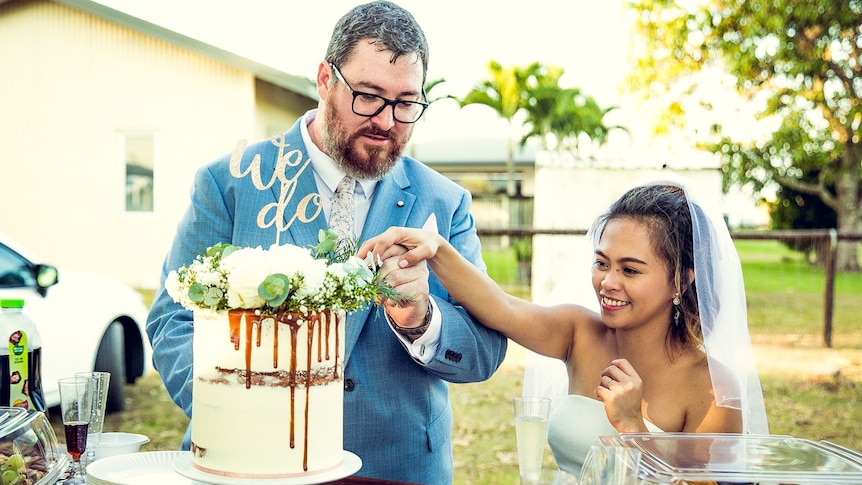 George Christensen and his wife April at their wedding