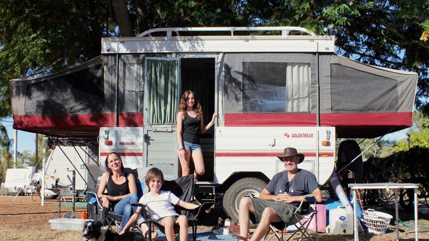 Tina, Sam, Amelie and Simon Storey (from left) standing out the front of their small caravan.