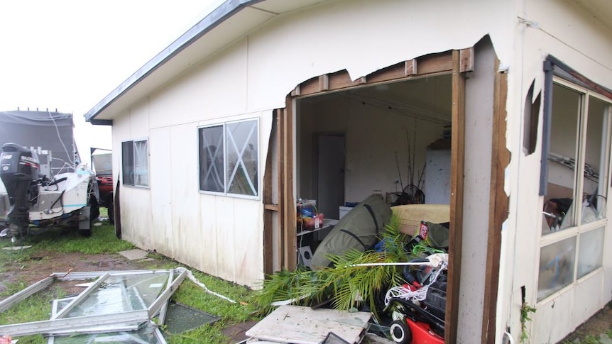 The side of a house was ripped off in Airlie Beach, leaving one side entirely exposed to the elements.