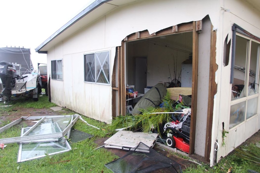 A house in Airlie Beach hit by Cyclone Debbie, had its side ripped off, leaving one side entirely exposed to the elements.