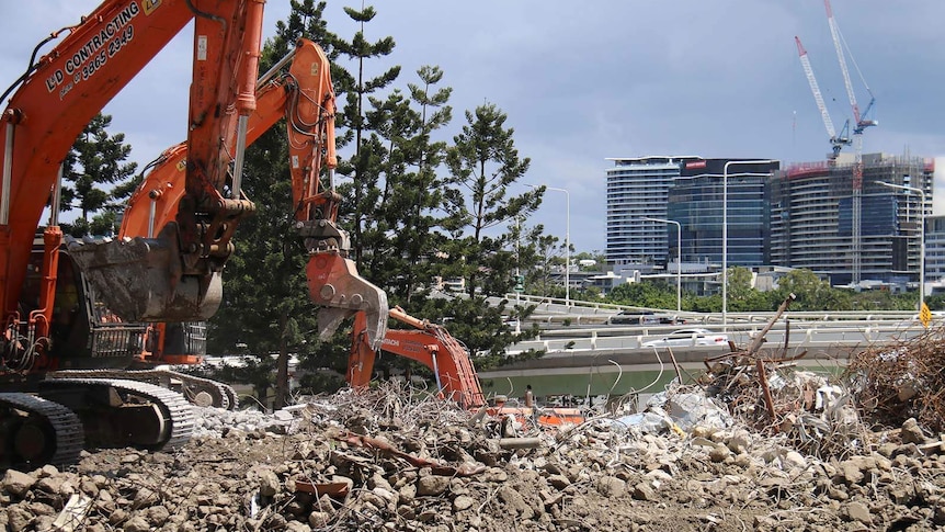 Earth movers on the Brisbane riverside demolition site