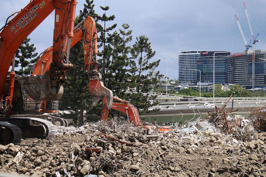 Earth movers on the Brisbane riverside demolition site