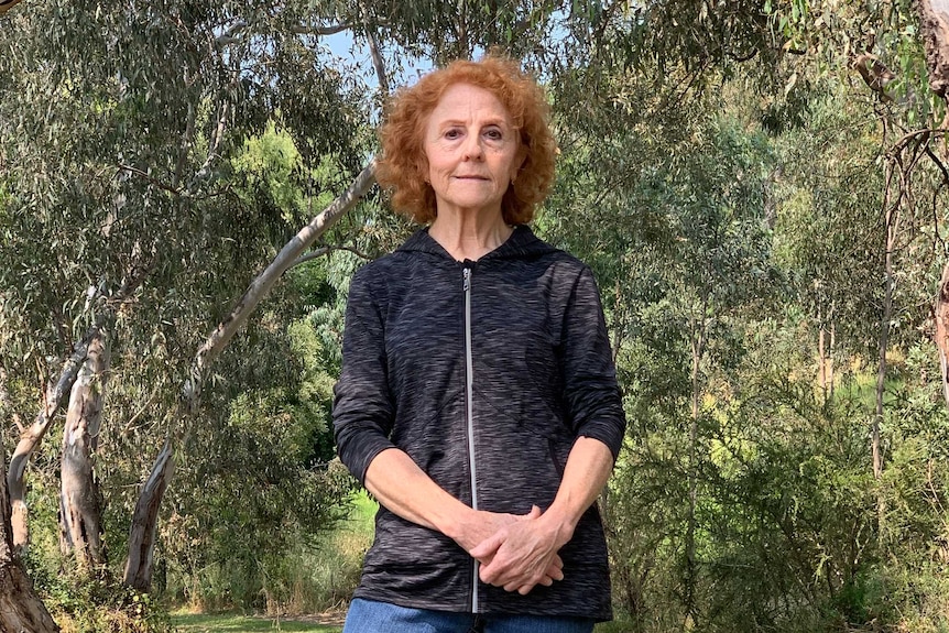 Mariella Di Fabio stands with trees behind her in Borlase Reserve.