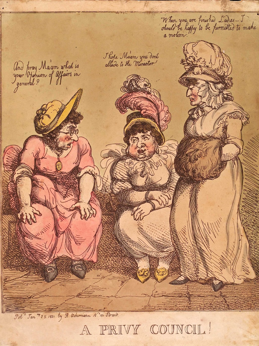 The woman seated on the left wears eyeglasses. The woman standing on the right has her hands in a muff.