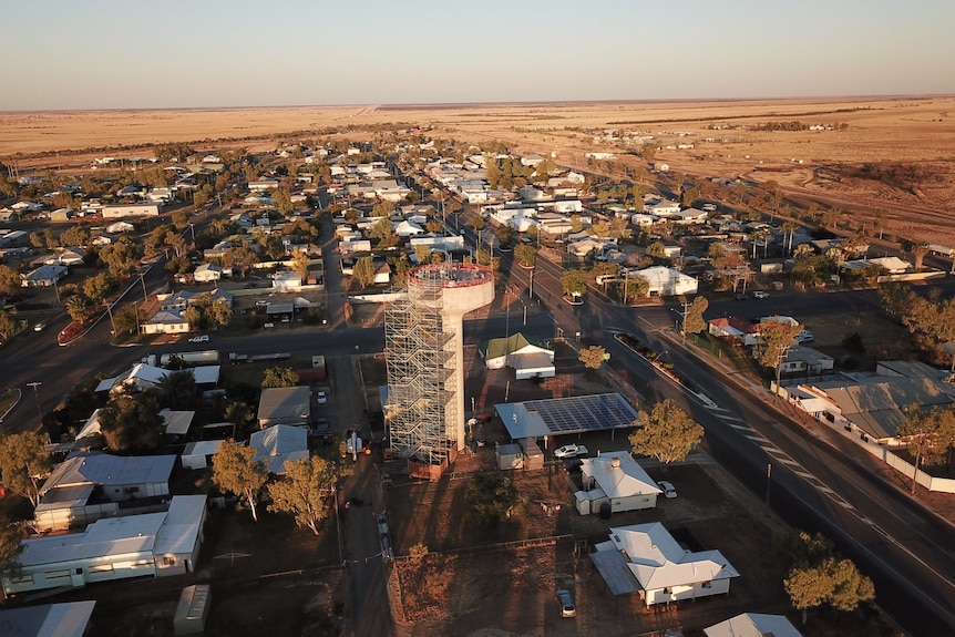 An aerial view of a small outback town showing the main street