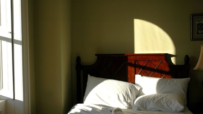 A British researcher says couples should seriously consider sleeping in separate beds.