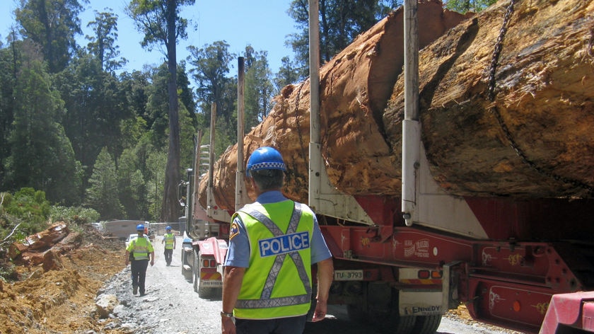 Back view of Tasmania police escorting a log truck out of Florentine Valley protest site.