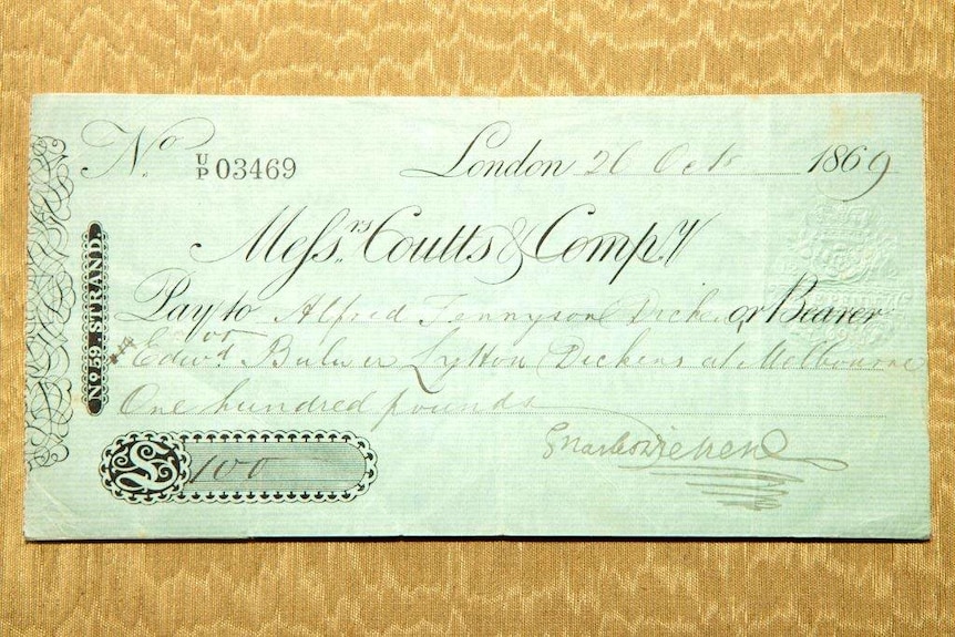 The personal cheque for 100 pounds sterling, signed by Charles Dickens.