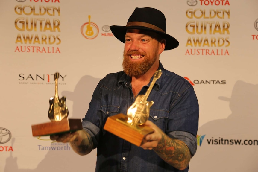 Andrew Swift with his two Golden Guitar awards