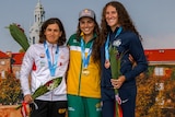 Jess Fox (centre) with Maialen Chourraut (left) and Ria Sribar on the medal podium in Kraków.