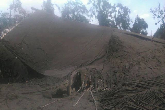 Ashfall from Manaro Volcano completely covers a house at Lolosori Village, Ambae island.